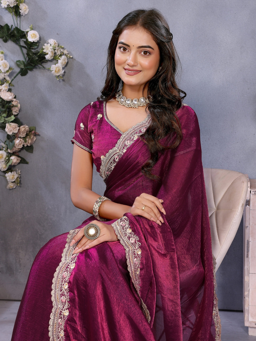 Solid saree with embellished scalloped border and zari-embroidered blouse.