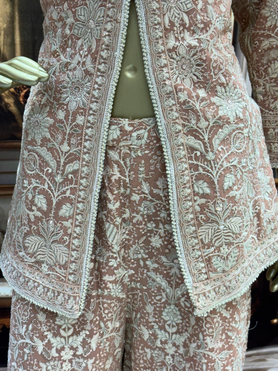 Thread embroidered kurta palazzo set with sequins and tasselled dupatta.