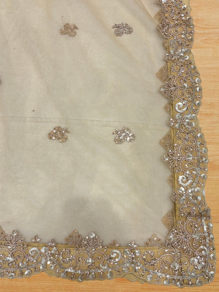 Champagne gold heavy sequin embroidered net lehenga set with scalloped border dupatta.