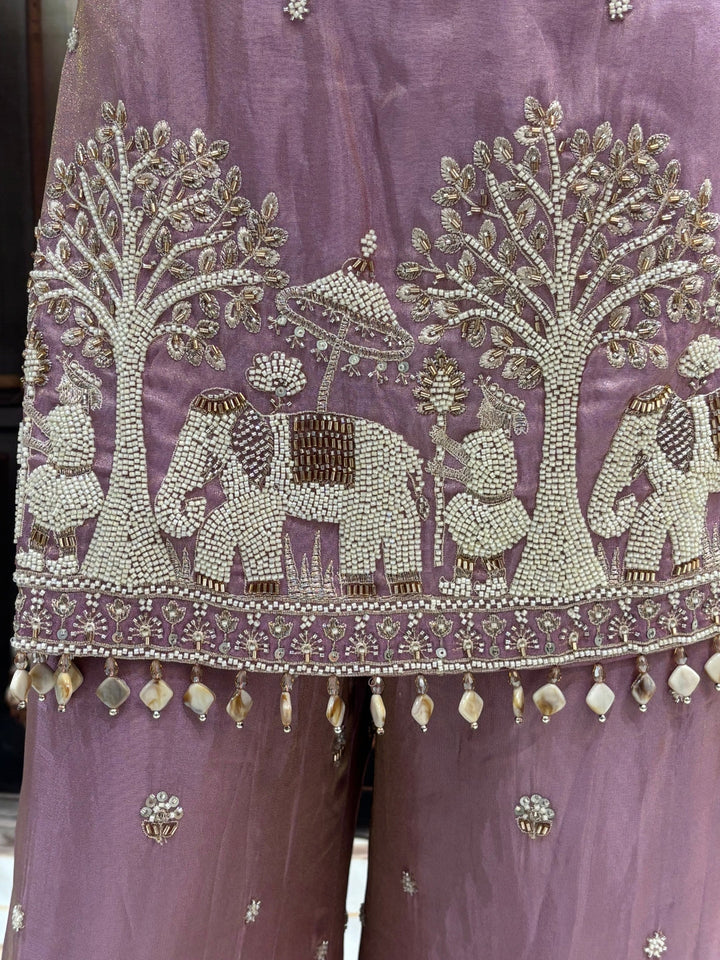 Art silk kurta palazzo set with pearl, bead & zari elephant scene embroidery.