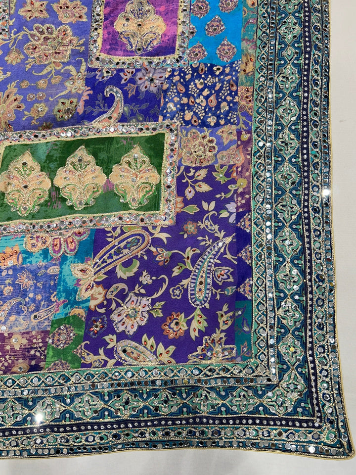 Digital-print saree with heavy mirror, stone & zari embroidered border and blouse.