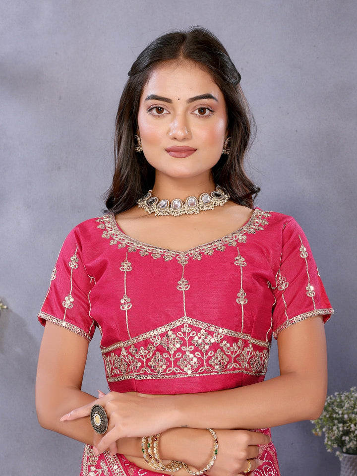 Bandhani-print saree with zari & mirror embellished border and embroidered blouse.