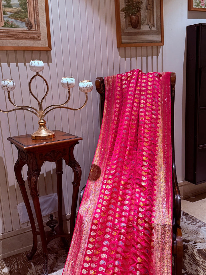 Pink Banarasi Saree with All-over Gold Zari Buta and Dual-Tone Geometric Woven Border
