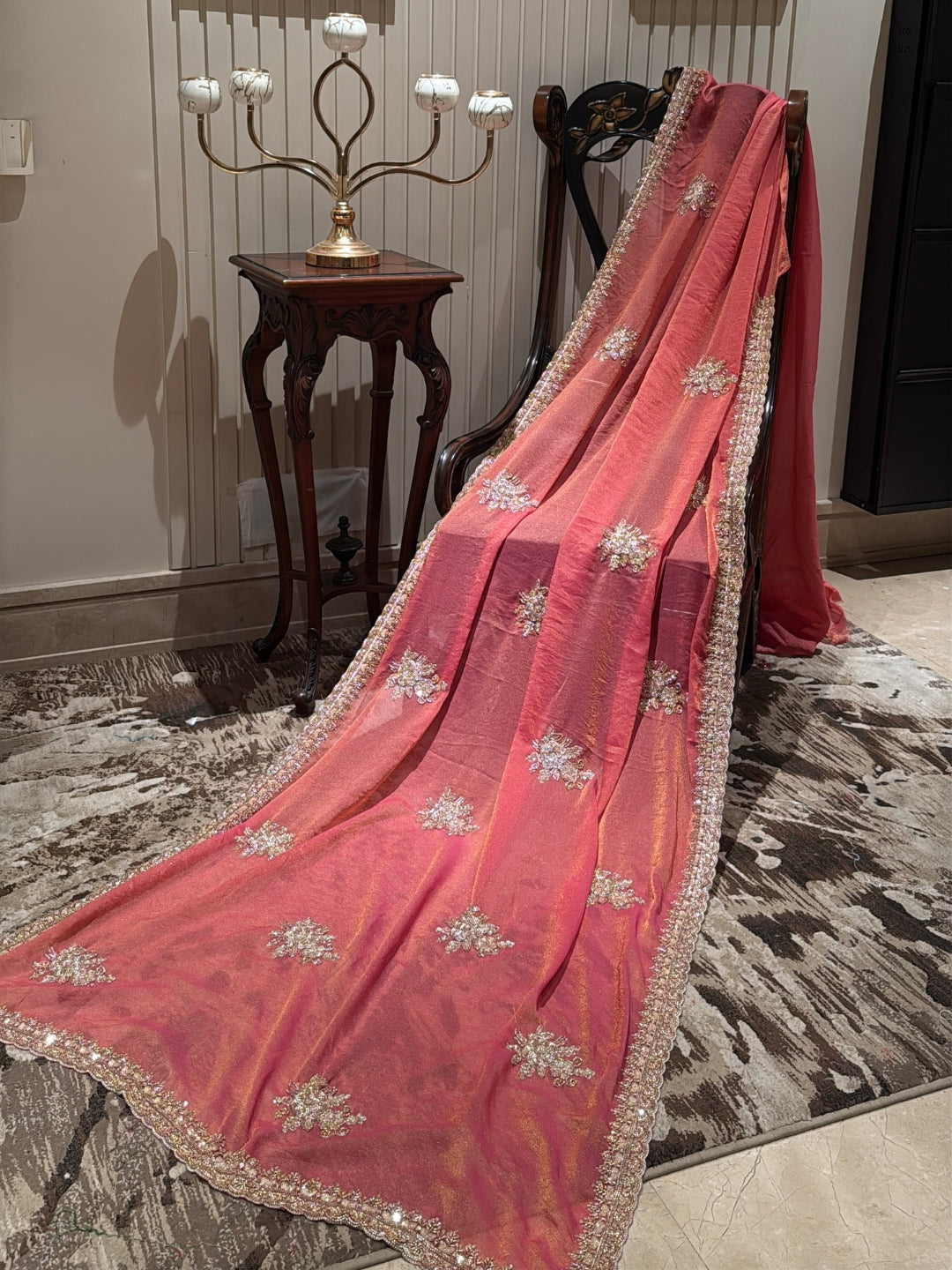 Peach-Pink Shimmer Saree with Golden Sequin Floral Motifs & Heavy Embellished Border