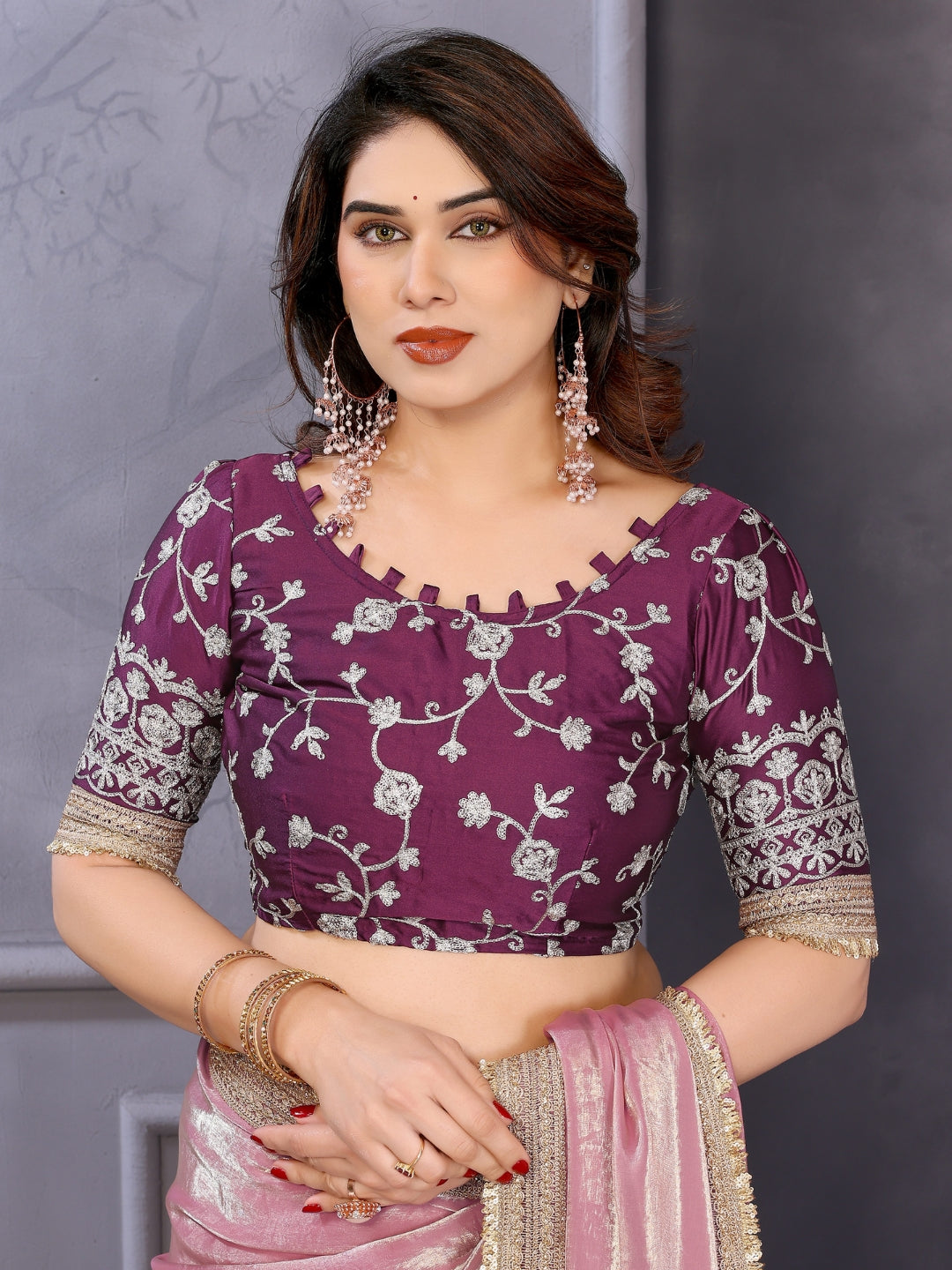 Shimmer solid saree with embellished border & contrast floral embroidered blouse.