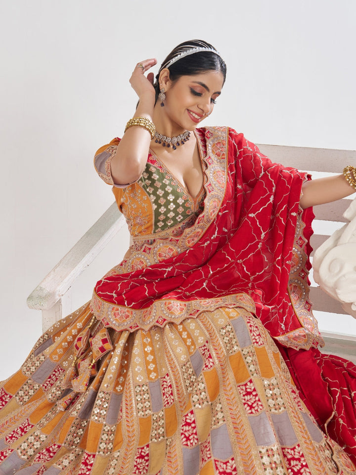 Multi-colour patchwork lehenga choli with mirror, zari & gota embroidery and bandhani dupatta.