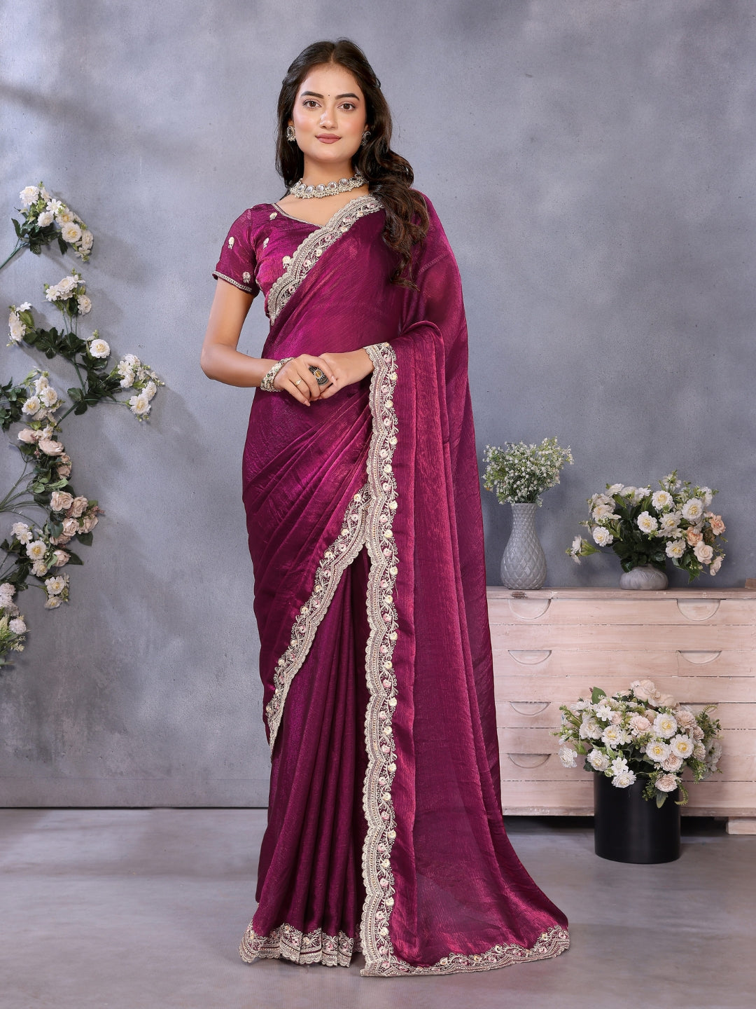 Solid saree with embellished scalloped border and zari-embroidered blouse.