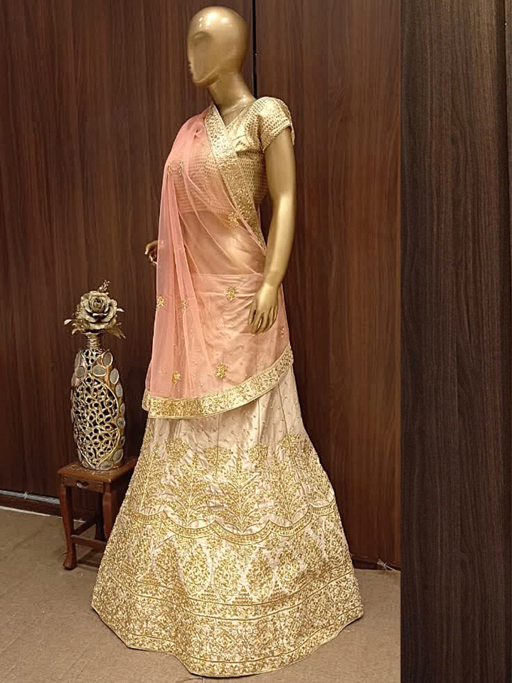 Rose Gold Semi-Stitched Silk Lehenga Set with Net Dupatta With Gold Aari Embroidery