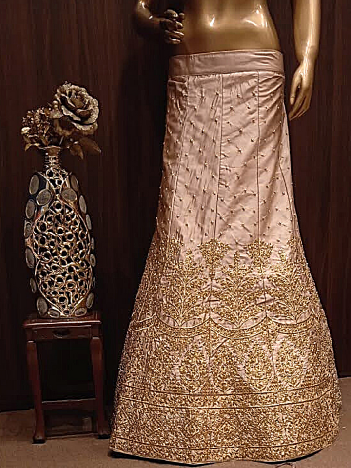 Rose Gold Semi-Stitched Silk Lehenga Set with Net Dupatta With Gold Aari Embroidery