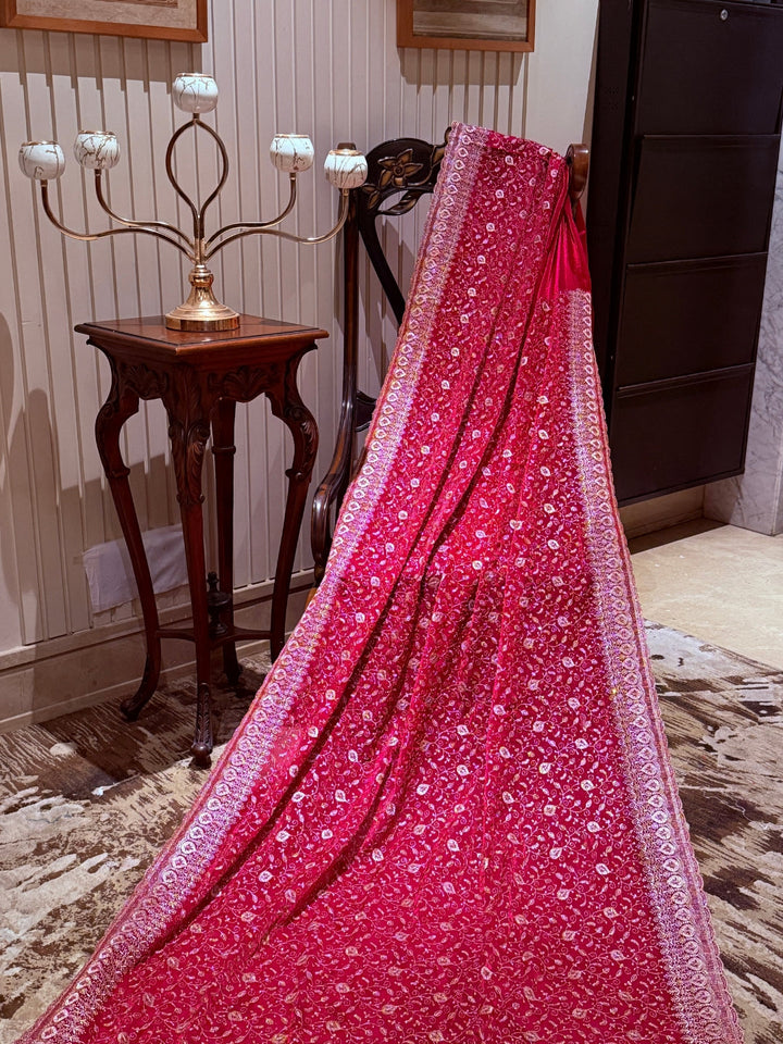 Pinkish Red Saree with Heavy Golden Zari Embroidery & Ornate Floral Motif Border Work