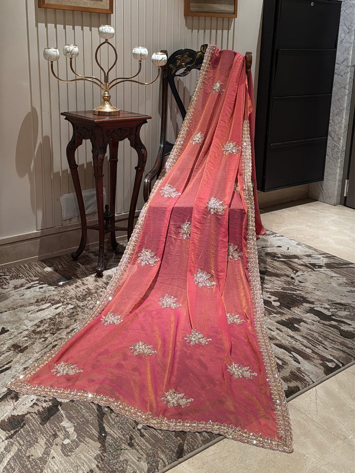 Peach-Pink Shimmer Saree with Golden Sequin Floral Motifs & Heavy Embellished Border