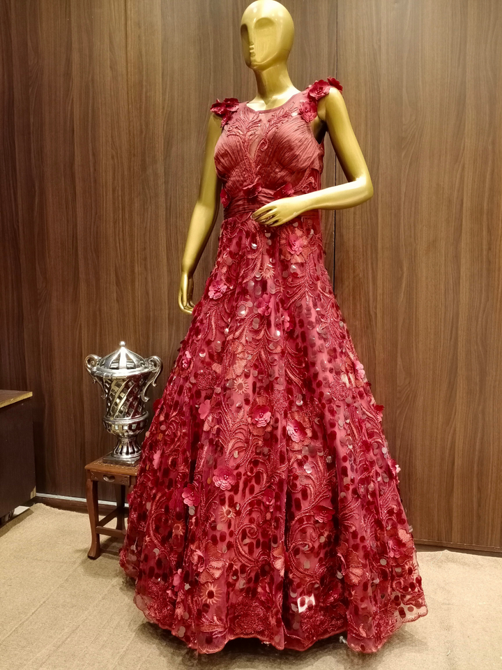 Maroon Embellished Net Gown with Pleating Ruching Neckline & Hand Sequence Embroidery