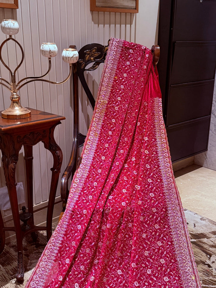 Pinkish Red Saree with Heavy Golden Zari Embroidery & Ornate Floral Motif Border Work