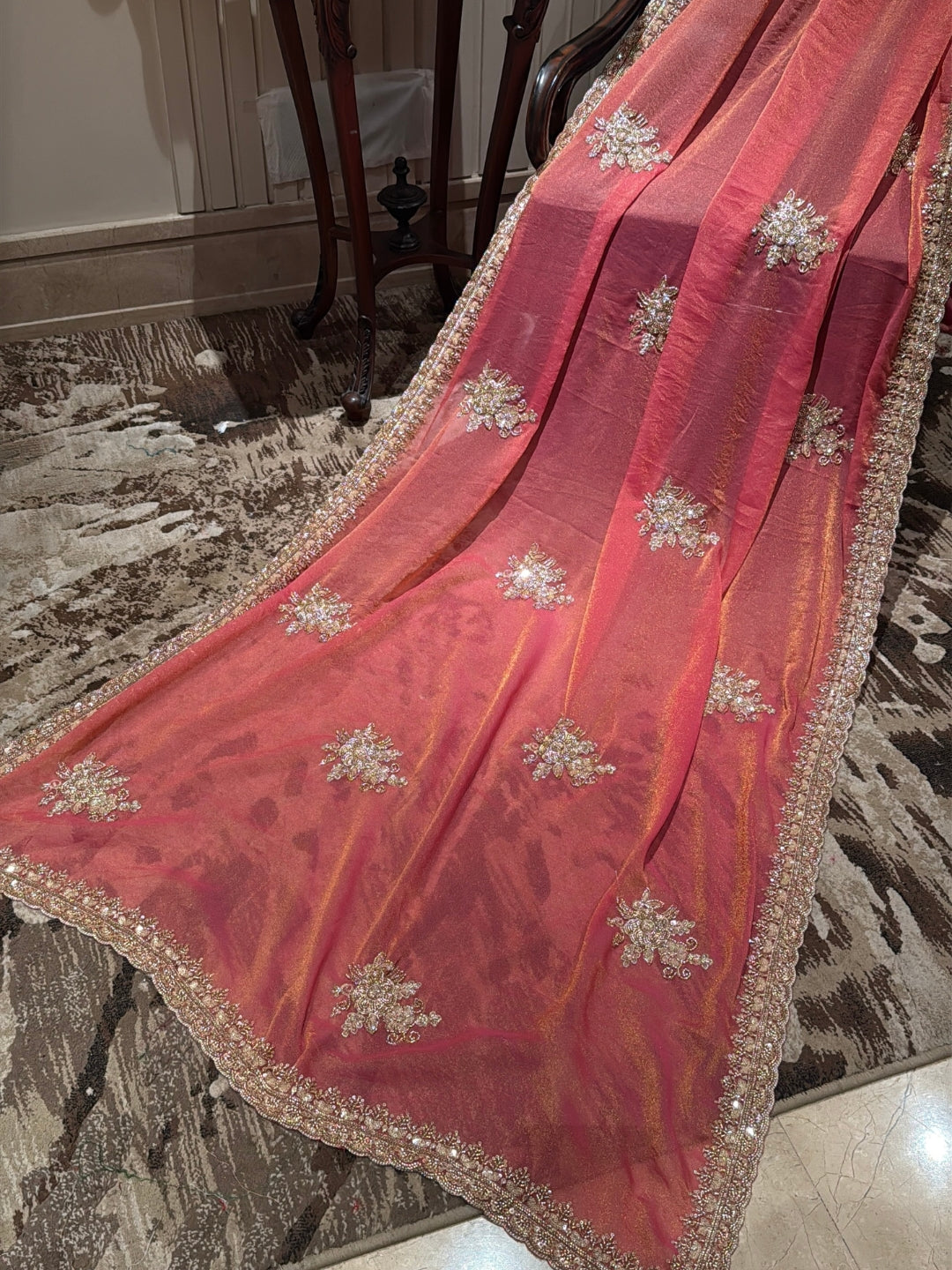 Peach-Pink Shimmer Saree with Golden Sequin Floral Motifs & Heavy Embellished Border