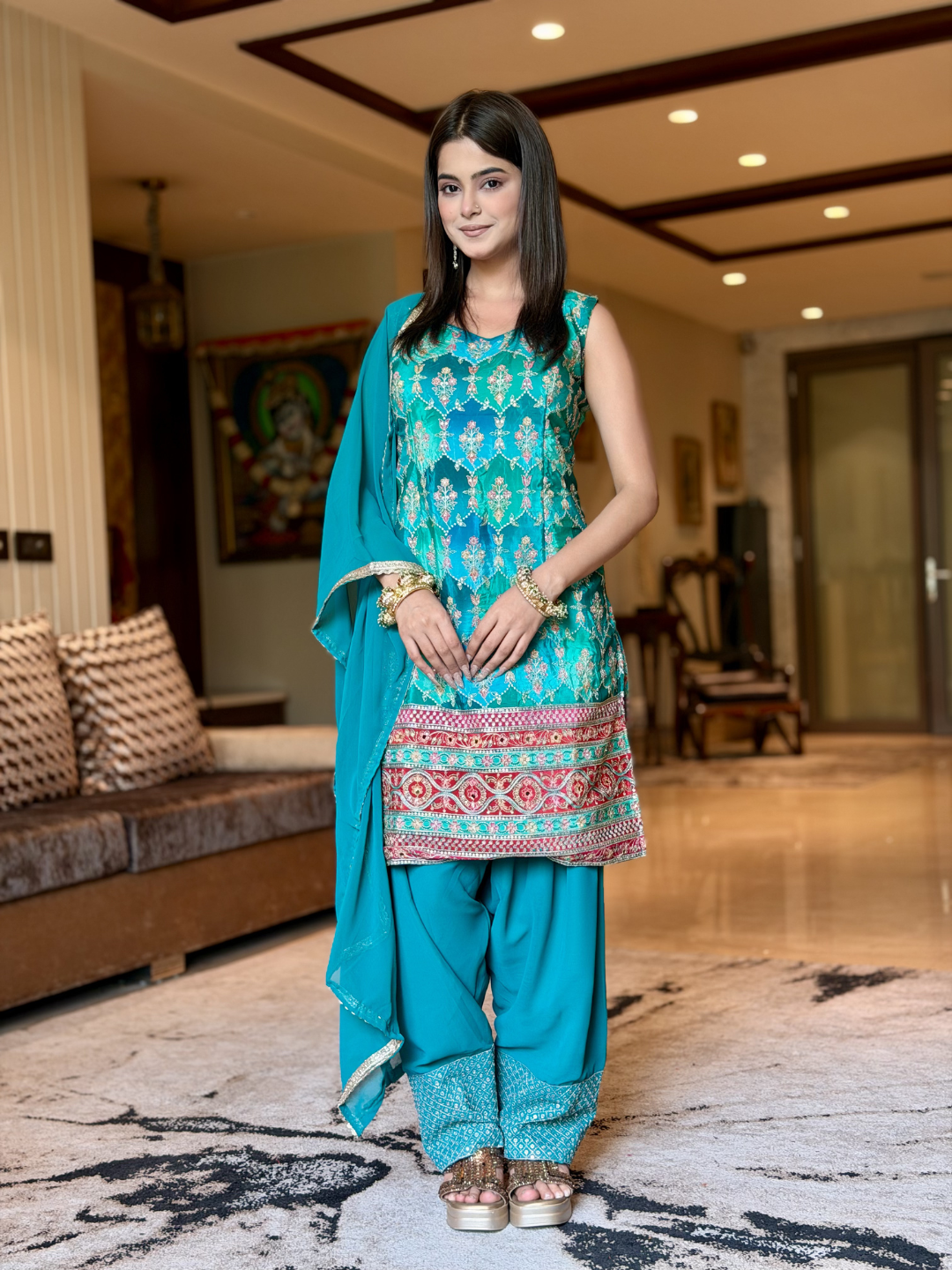 Crepe Heavy Sequin & Zari Embroidered Sleeveless Kurti with Georgette Salwar and Dupatta in Turquoise