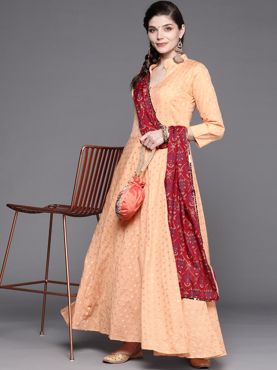 Peach Banarasi Weaving Anarkali Suit With Contrast Bandhej Foil Dupatta & Gold Buttons