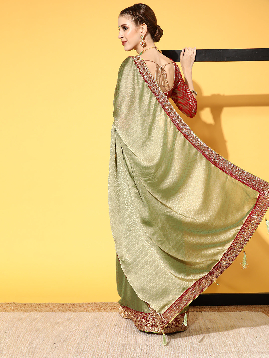 Mehendi Green Brasso Self Design Saree With Geometrical Weaves