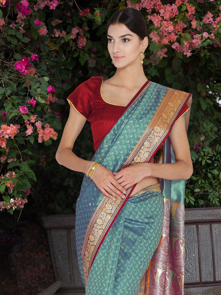 Peacock Blue Banarasi Silk saree with Zari Woven paisleys and Rich Contrast Border