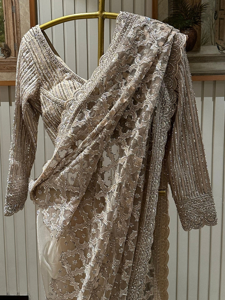 Elegant Beige Embroidered Net Saree