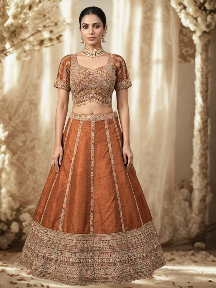Rust Brown Crepe Lehenga Choli with Heavy Resham & Zari Embroidered Blouse, Tassel Hem & Embroidered Border