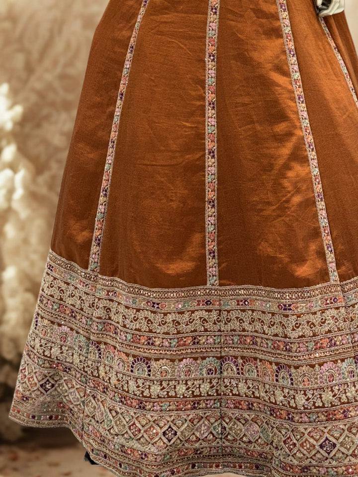 Rust Brown Crepe Lehenga Choli with Heavy Resham & Zari Embroidered Blouse, Tassel Hem & Embroidered Border