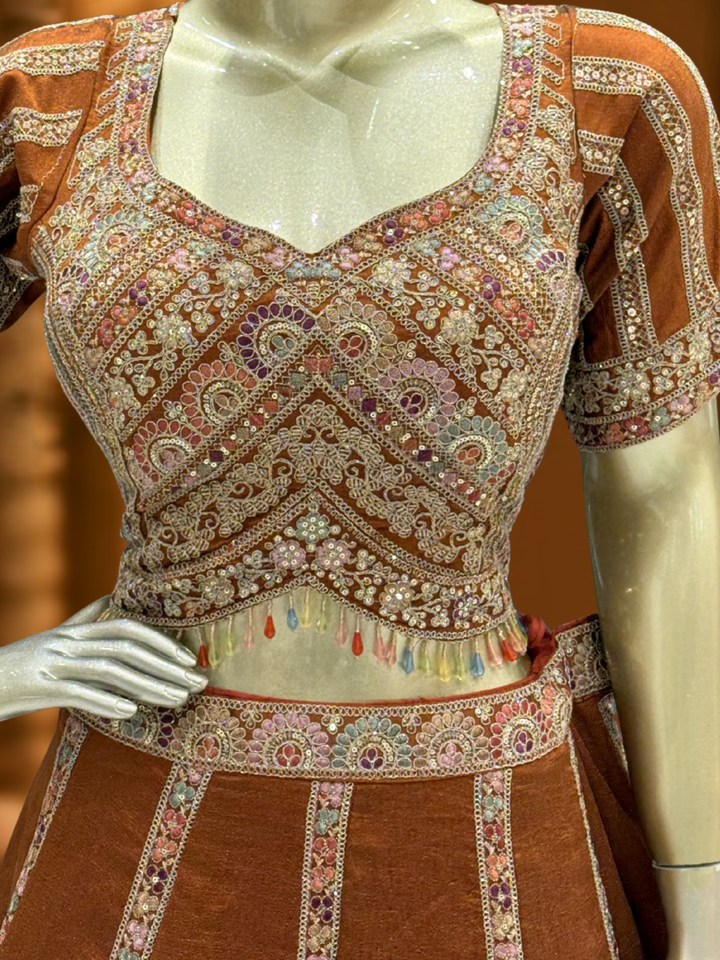 Rust Brown Crepe Lehenga Choli with Heavy Resham & Zari Embroidered Blouse, Tassel Hem & Embroidered Border