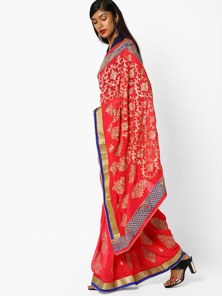 Coral Pink Zari Embroidered Georgette Saree With Ethnic Zaal Motifs and Contrast Border