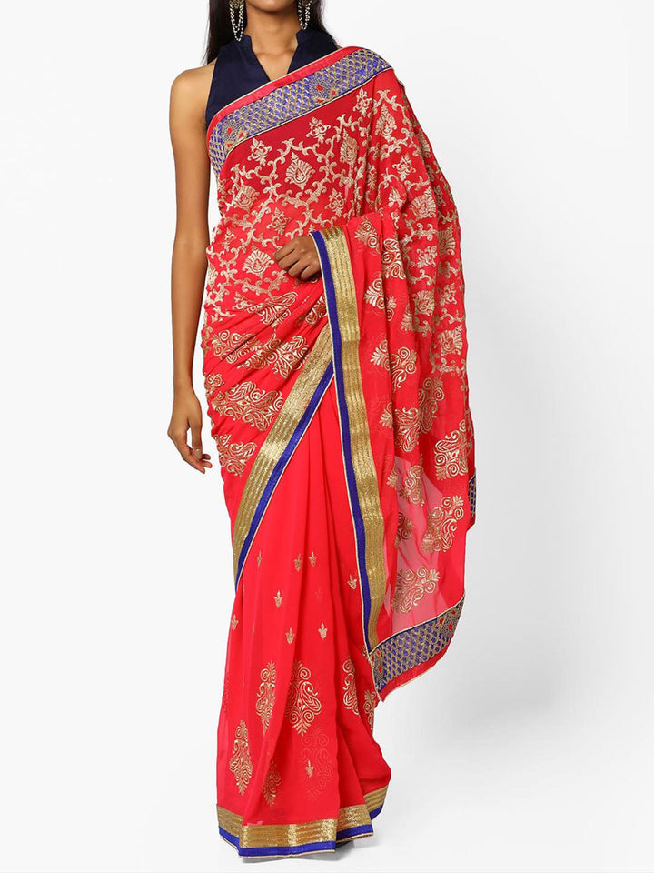 Coral Pink Zari Embroidered Georgette Saree With Ethnic Zaal Motifs and Contrast Border