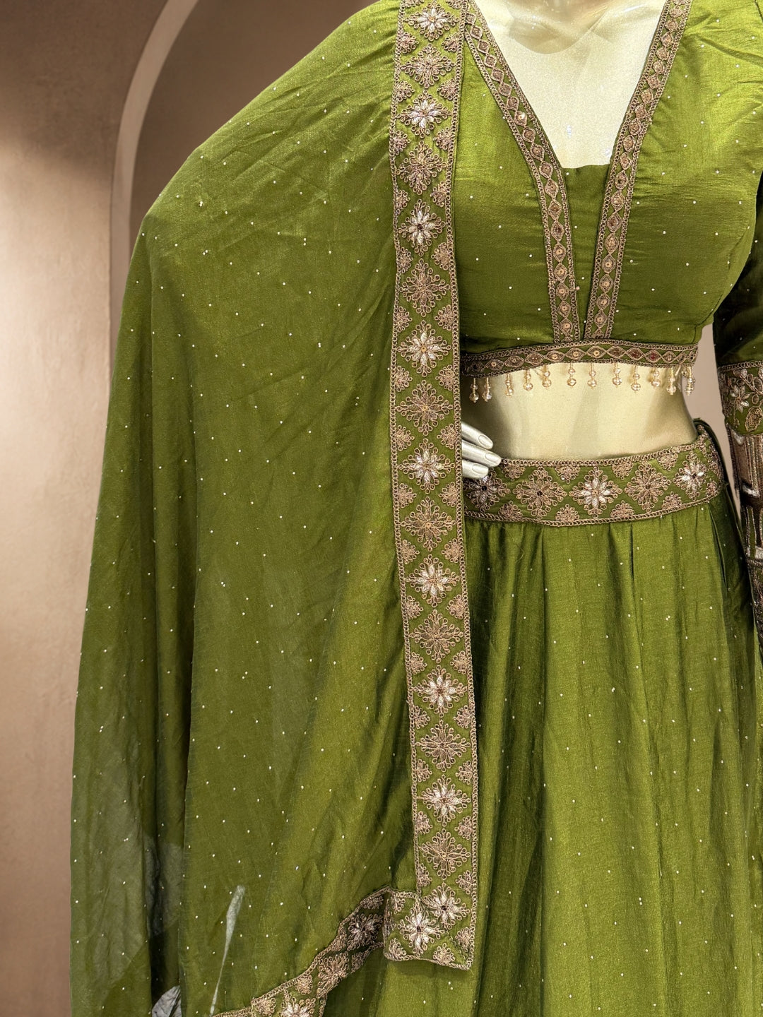 Mehendi Green Crepe Lehenga Choli with Antique Zari Elephant Motif Border & Sequin Work