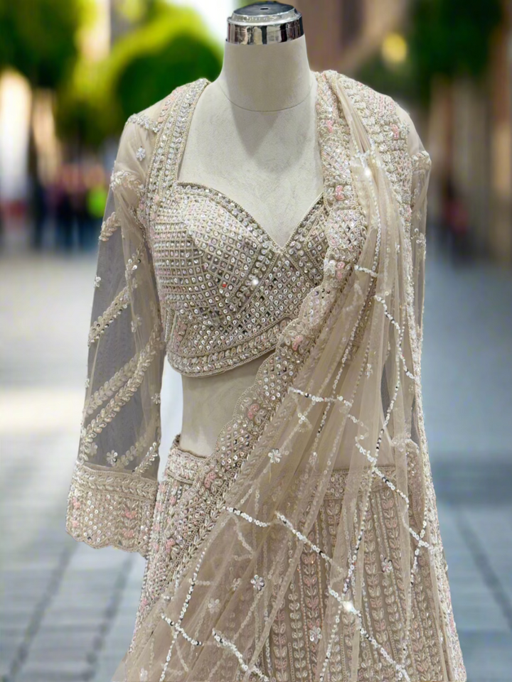 Exquisite Ivory Net Readymade Lehenga