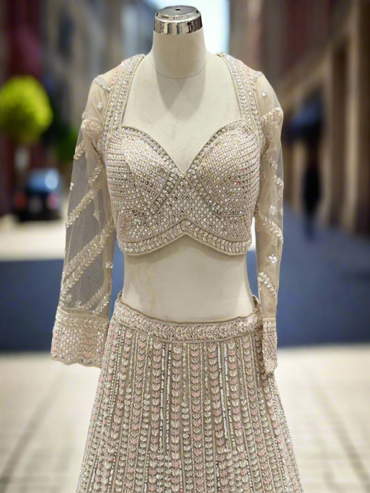 Exquisite Ivory Net Readymade Lehenga