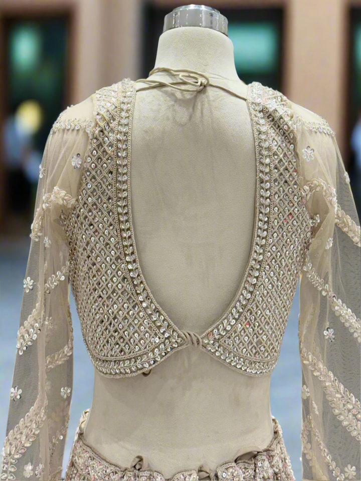 Exquisite Ivory Net Readymade Lehenga