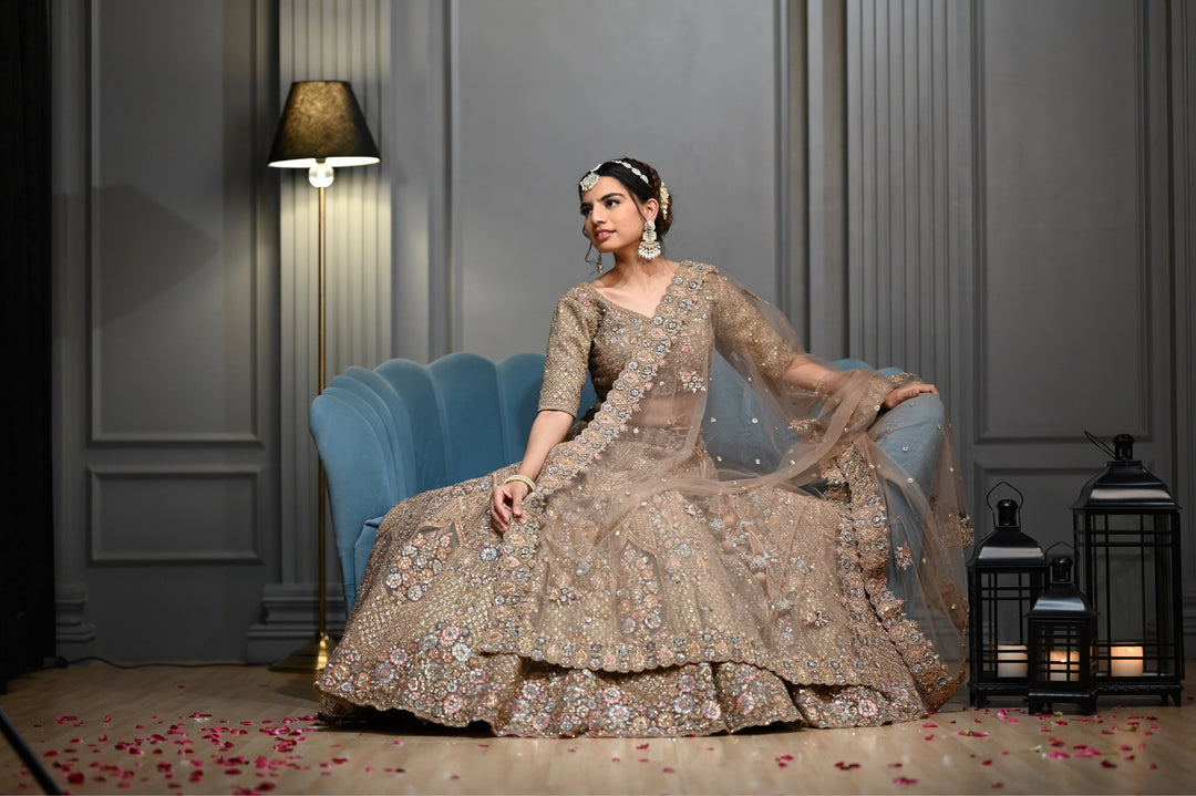 Bridal Gold lehenga with Zardozi, kundan, and Resham embroidery.