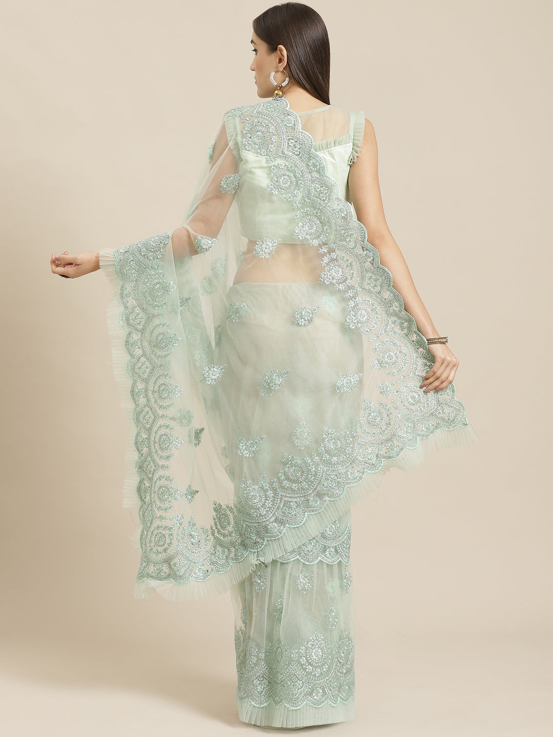 Sea Green Frills & Ruffles Net Saree with Heavy Silver Zari & Resham Embroidery