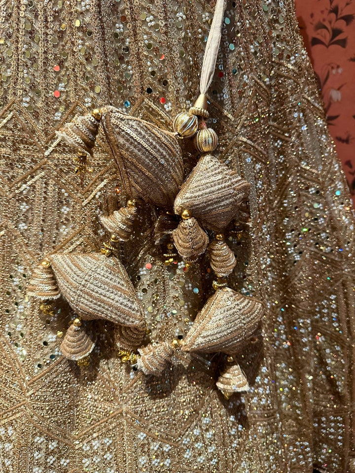 Ethereal Beige Tassel-Accented Bridal Lehenga