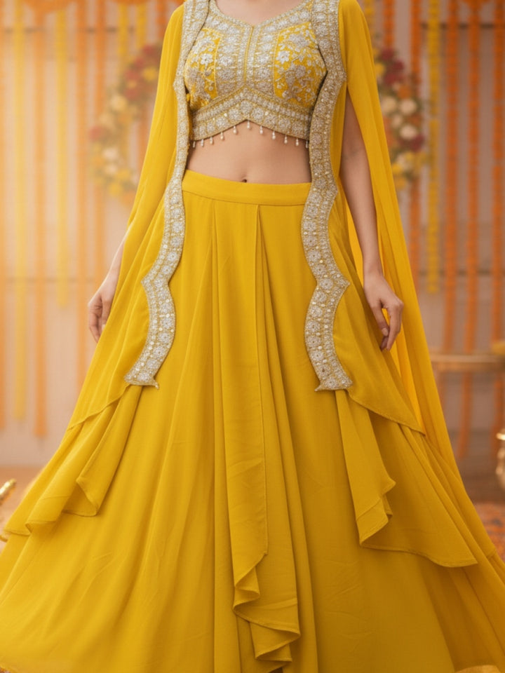 Haldi Yellow Embroidered Mirror Work Tasseled Blouse With Draped Skirt & Scalloped Cape