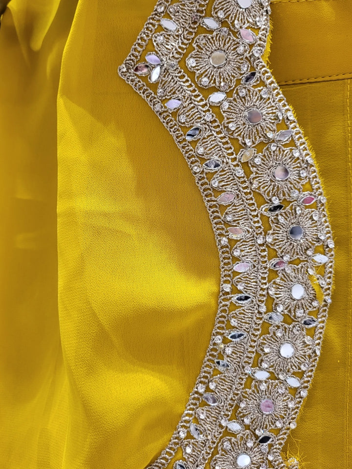 Haldi Yellow Embroidered Mirror Work Tasseled Blouse With Draped Skirt & Scalloped Cape