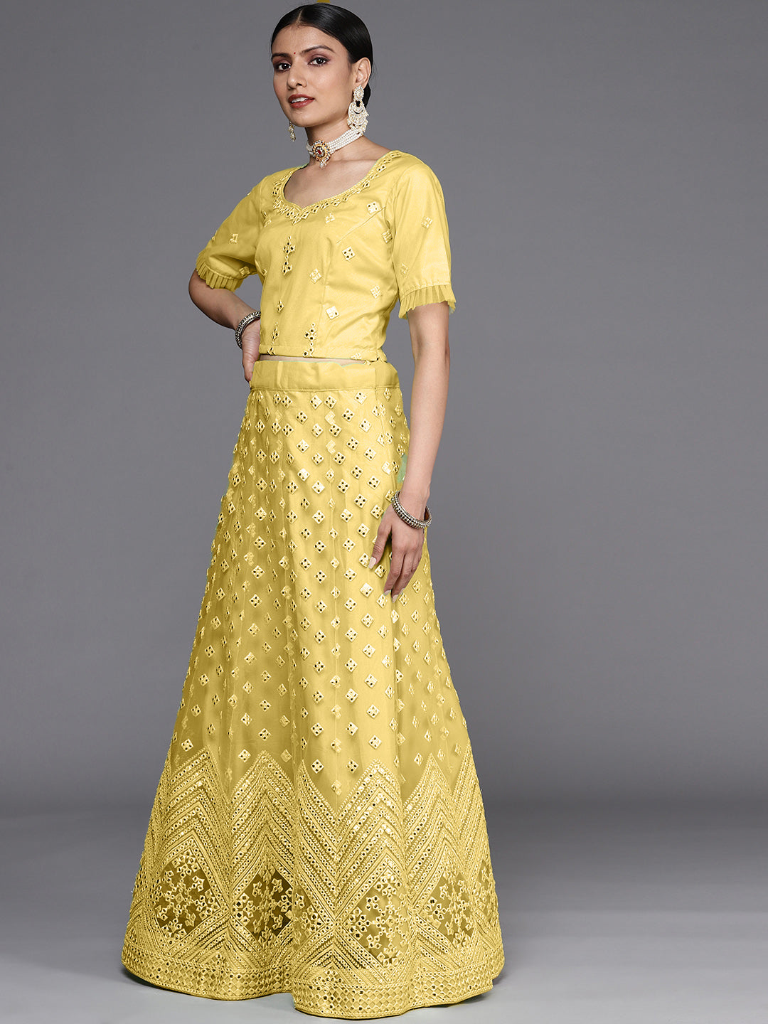 Semi Stitch Yellow Mirror Embellished Chevron Net Lehenga Choli Set