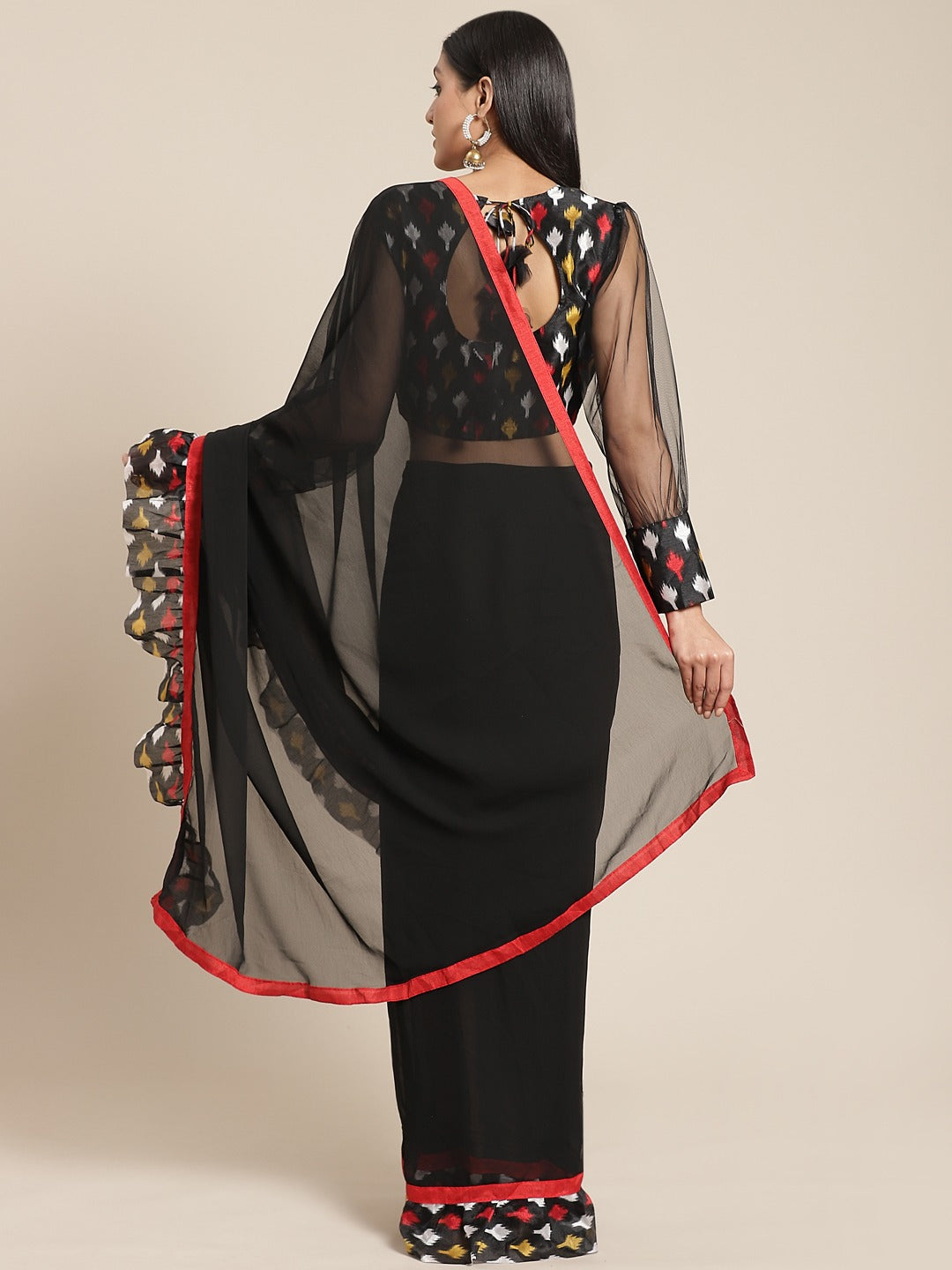 Fusion Black Georgette Ruffed Saree With Bold Ikat inspired Prints