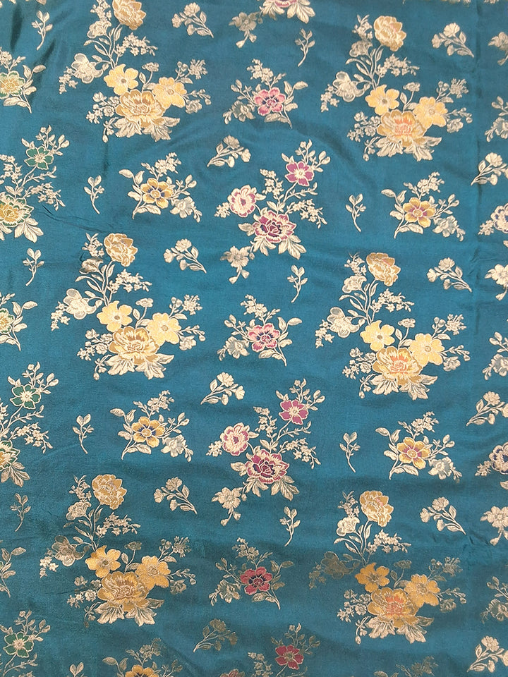 Teal Blue Banarasi Silk Saree with Multicolor Floral Weave and Contrast Pink Border