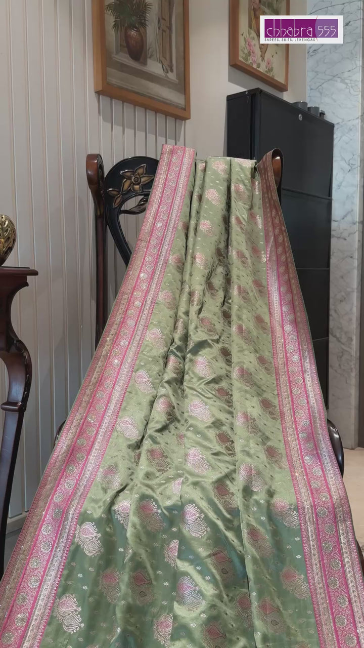 Pastel Green Pink Zari Butta Woven Banarasi Art Silk Saree with Contrast Pallu Border.