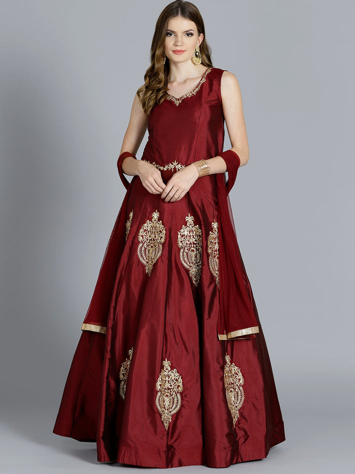 Chhabra 555 Maroon Gown with embroidered neckline and waist line in floral motifs