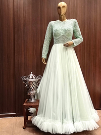 Pastel Green Flared Gown With Ruffled Hemline and Thread Embroidery