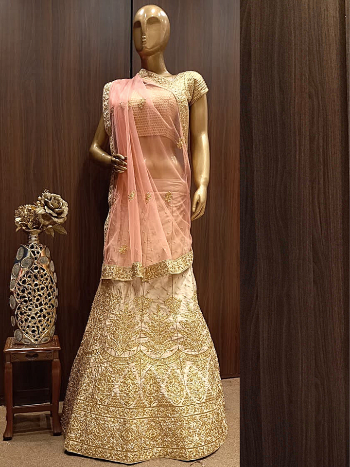 Rose Gold Semi-Stitched Silk Lehenga Set with Net Dupatta With Gold Aari Embroidery