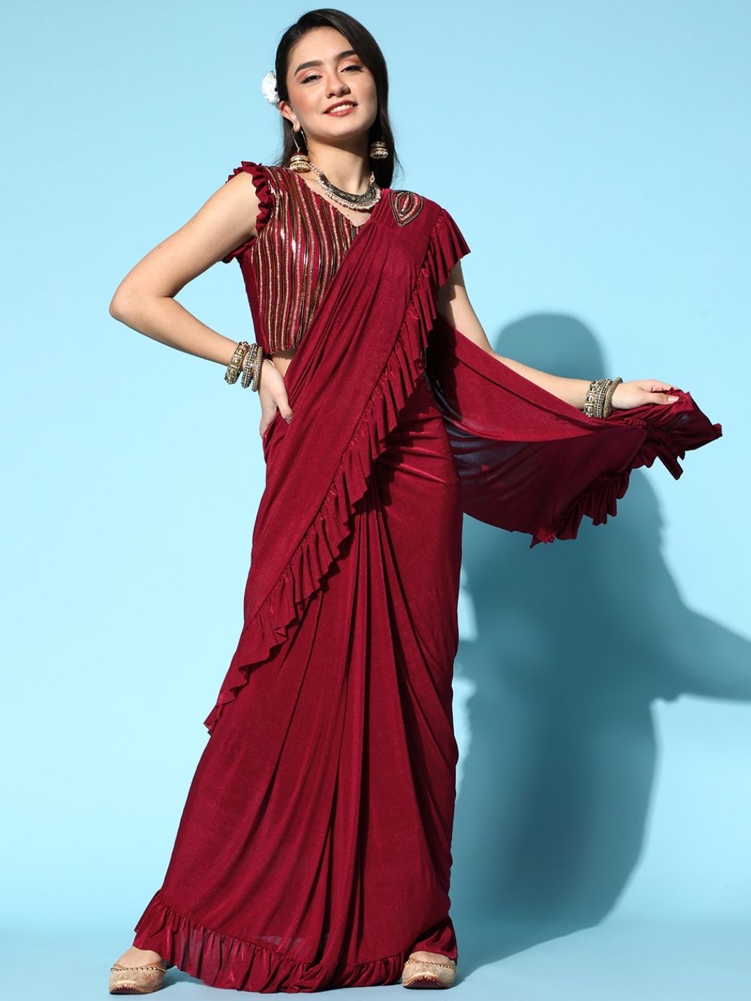 Chhabra 555 Maroon Pre-Stitched Draped Metallic Applique Embroidery Ruffled Saree 

Color: Maroon

Type: NA Sarees

Pattern: Embellished

Pattern Type: Embellished

Ornamentation: Patchwork

Border: No Border

Fabric: Viscose Rayon

Saree length: 5.50 mtr., Width: 1.10 mtr, Blouse Height: 14.5 inches
Dry Clean only. Saree Fabric is Lycra.

The CAD image gives a detailed look of the actual blouse piece that comes with this saree. The blouse used by the model in the pictures is only for styling purpose.