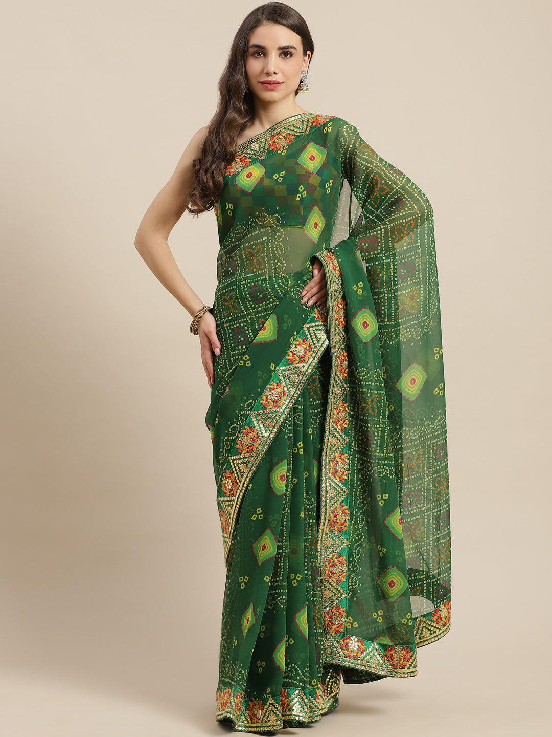 Chhabra 555 Green Jaipur Bandhani Prints Geogette Saree With Resham & Gota Patti Embroidery Border

Color: Green

Type: Bandhani Sarees

Pattern: Printed

Pattern Type: Bandhani

Ornamentation: Gotta Patti

Border: Embroidered

Fabric: Georgette

Saree length: 5.40 mtr., Width: 1.10 mtr, Blouse length: 0.70 mtr
Dry Clean

The CAD image gives a detailed look of the actual blouse piece that comes with this saree. The blouse used by the model in the pictures is only for styling purpose.