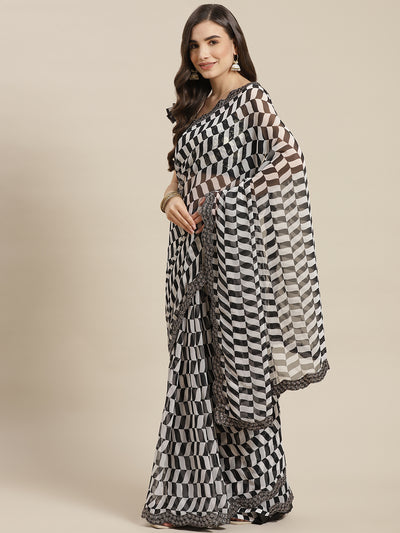 Chhabra 555 Black & White Printed Geometerical Georgette Embellished Saree with Scalloped border

Color: Black & White

Type: Leheriya Sarees

Pattern: Printed

Pattern Type: Geometric

Ornamentation: Sequinned

Border: Embroidered

Fabric: Poly Georgette

Saree length: 5.40 mtr., Width: 1.10 mtr, Blouse length: 0.70 mtr
Dry Clean Only

The CAD image gives a detailed look of the actual blouse piece that comes with this saree. The blouse used by the model in the pictures is only for styling purpose.