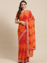 Chhabra 555 Red & Orange Georgette Bandhani Print Saree Embellished & Gota Patti Jaipuri Border

Color: Red & Orange

Type: Bandhani Sarees

Pattern: Printed

Pattern Type: Bandhani

Ornamentation: Gotta Patti

Border: Embroidered

Fabric: Georgette

Saree length: 5.40 mtr., Width: 1.10 mtr, Blouse length: 0.70 mtr
Dry Clean

The CAD image gives a detailed look of the actual blouse piece that comes with this saree. The blouse used by the model in the pictures is only for styling purpose.