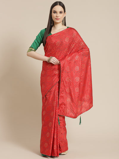Chhabra 555 Red Silk Blend Batik Bandhani Pattern Saree With Contrast Blouse & Tassels 

Color: Red

Type: Bandhani Sarees

Pattern: Printed

Pattern Type: Bandhani

Ornamentation: Beads and Stones

Border: No Border

Fabric: Silk Blend

Saree length: 5.10 mtr., Width: 1.10 mtr, Blouse length: 0.70 mtr
Dry Clean only

The CAD image gives a detailed look of the actual blouse piece that comes with this saree. The blouse used by the model in the pictures is only for styling purpose.