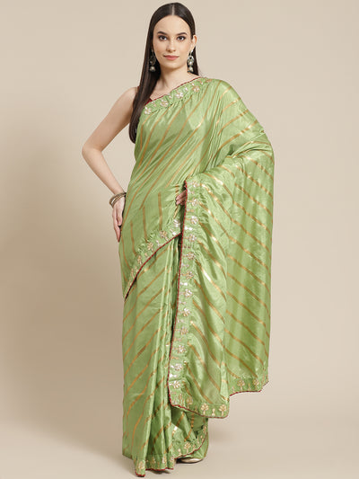 Chhabra 555 Lime Green Foil print Leheriya Style Saree with Gota Patti Embroidery Border

Color: Lime Green

Type: Leheriya Sarees

Pattern: Embellished

Pattern Type: Leheriya

Ornamentation: Gotta Patti

Border: Embroidered

Fabric: Silk Blend

Saree length: 5.00 mtr., Width: 1.10 mtr, Blouse length: 0.70 mtr
Dry Clean only

The CAD image gives a detailed look of the actual blouse piece that comes with this saree. The blouse used by the model in the pictures is only for styling purpose.